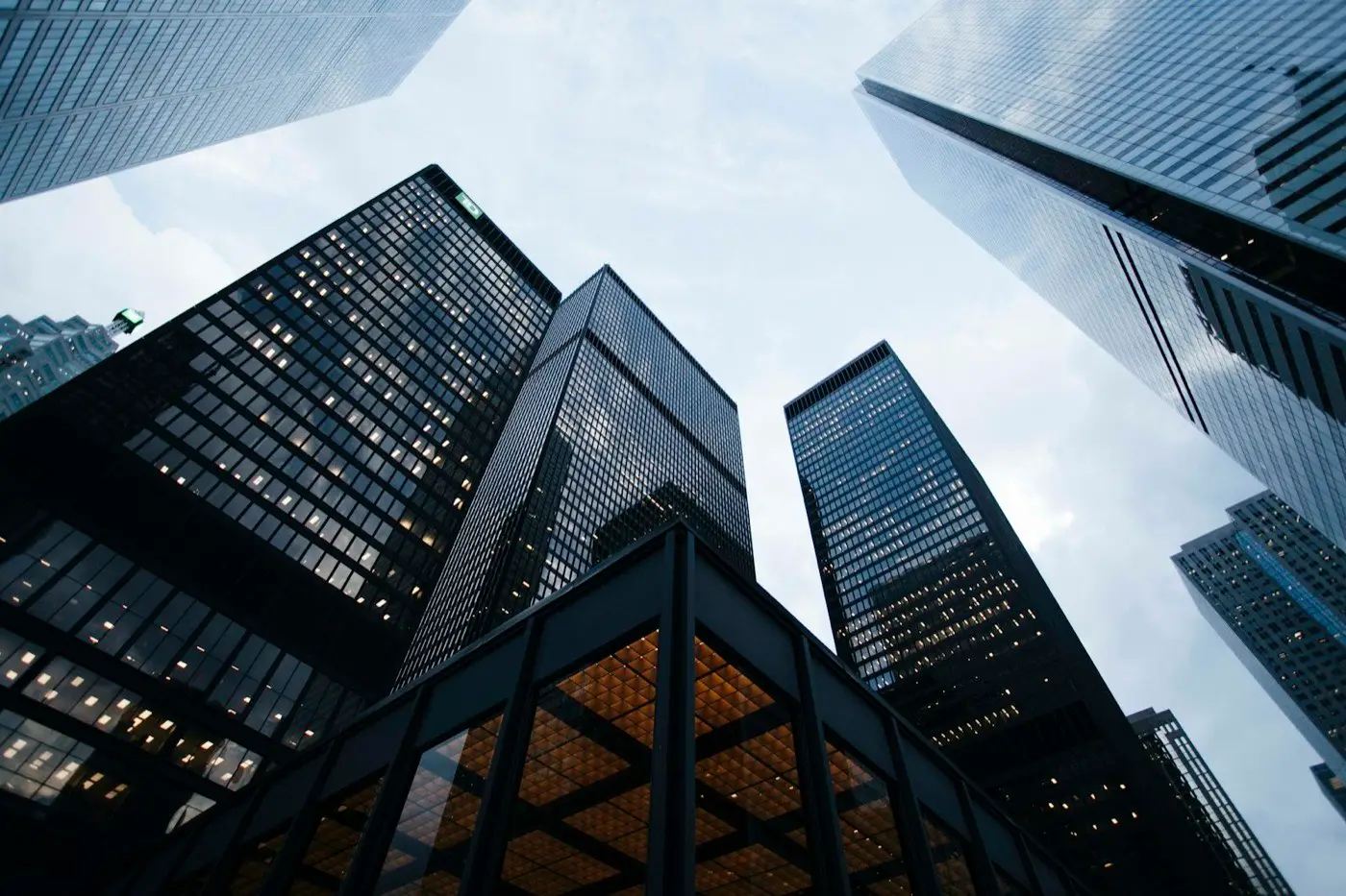 Modern office towers viewed from below against the sky