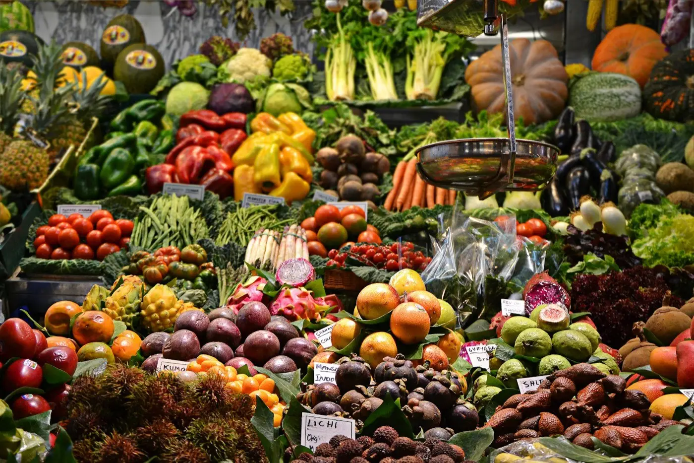 A vibrant traditional produce market stall in Indonesia